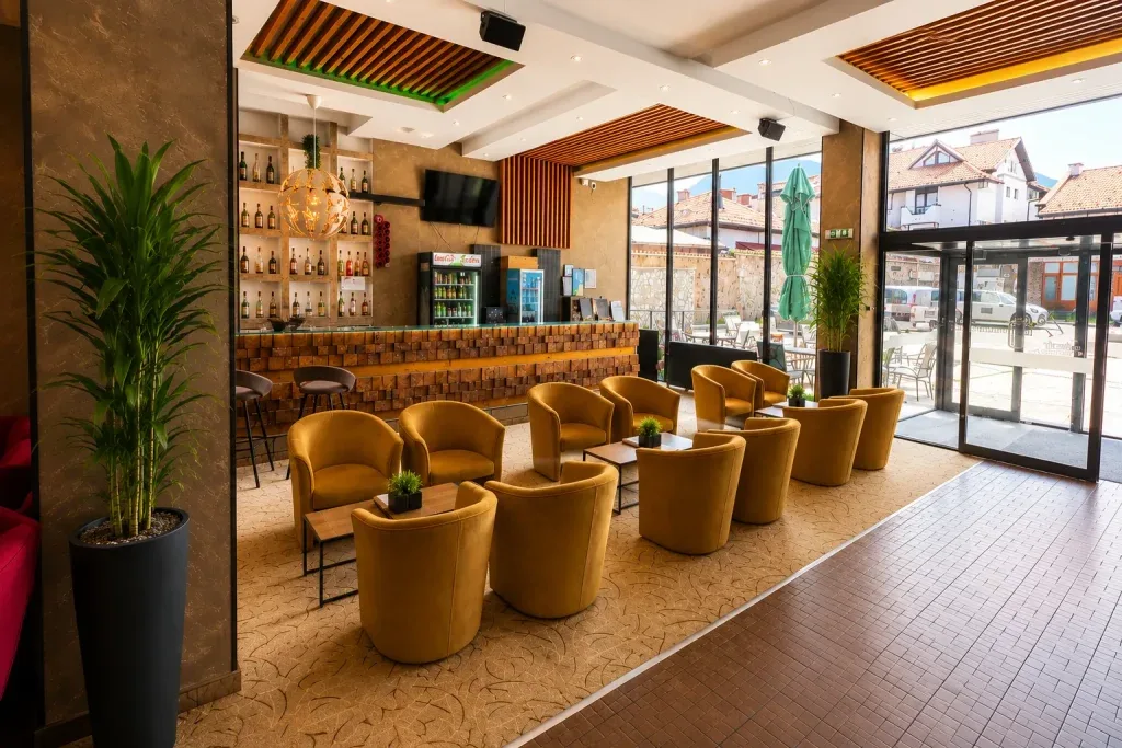 Lobby bar with armchairs and panoramic windows