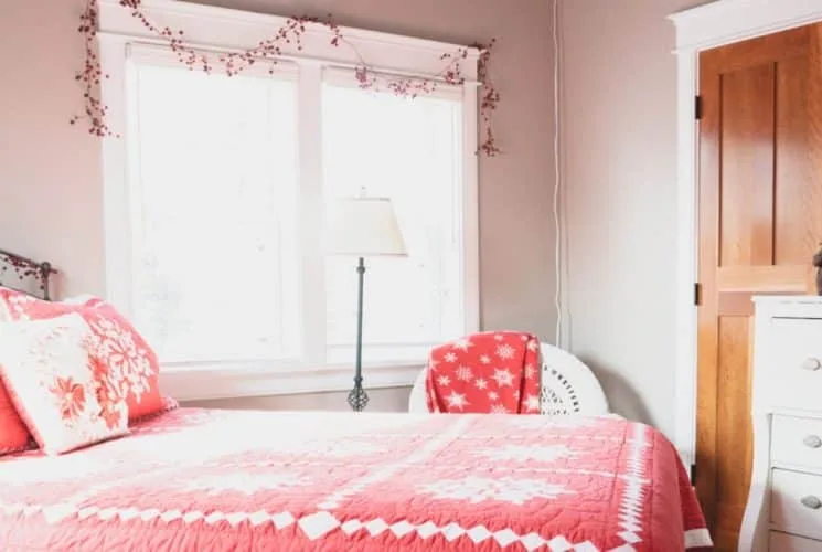 Farmhouse-style bedroom with antique and modern furniture