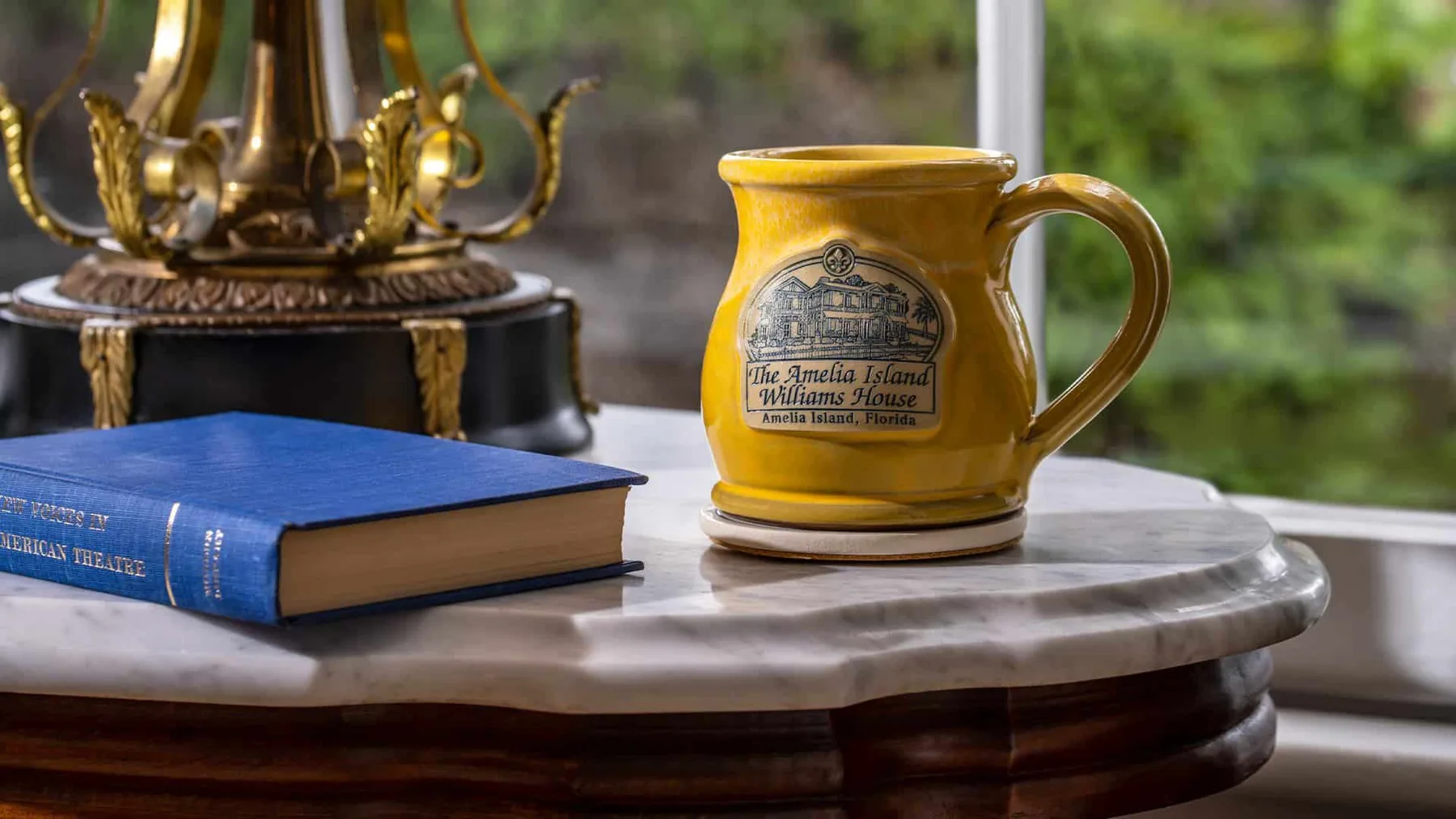 Mug and book on a wooden stool