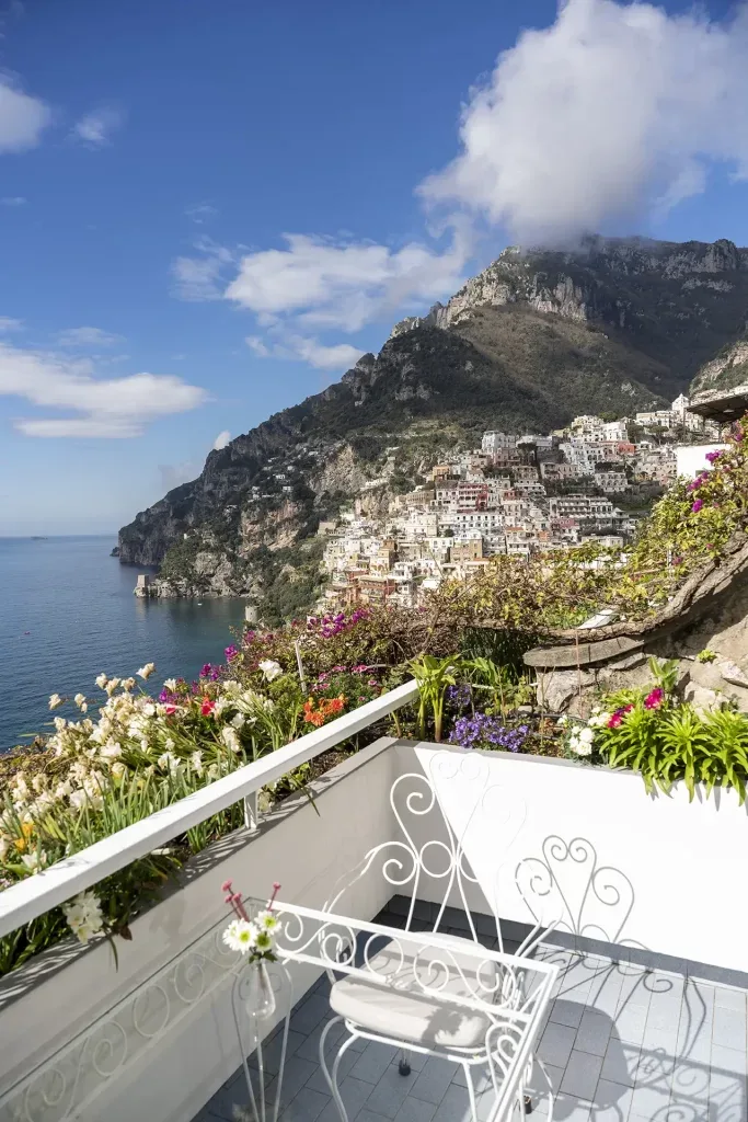 View of Positano from a flower-filled terrace.