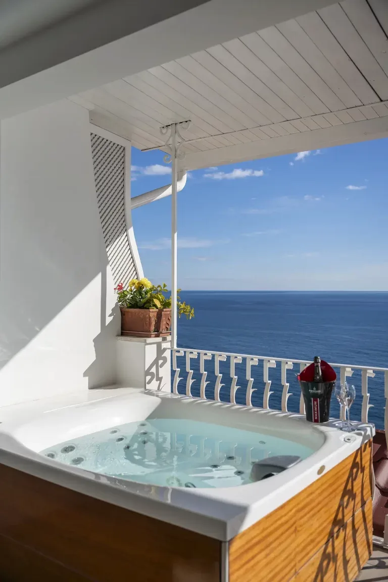 Jacuzzi on a balcony with sea views.
