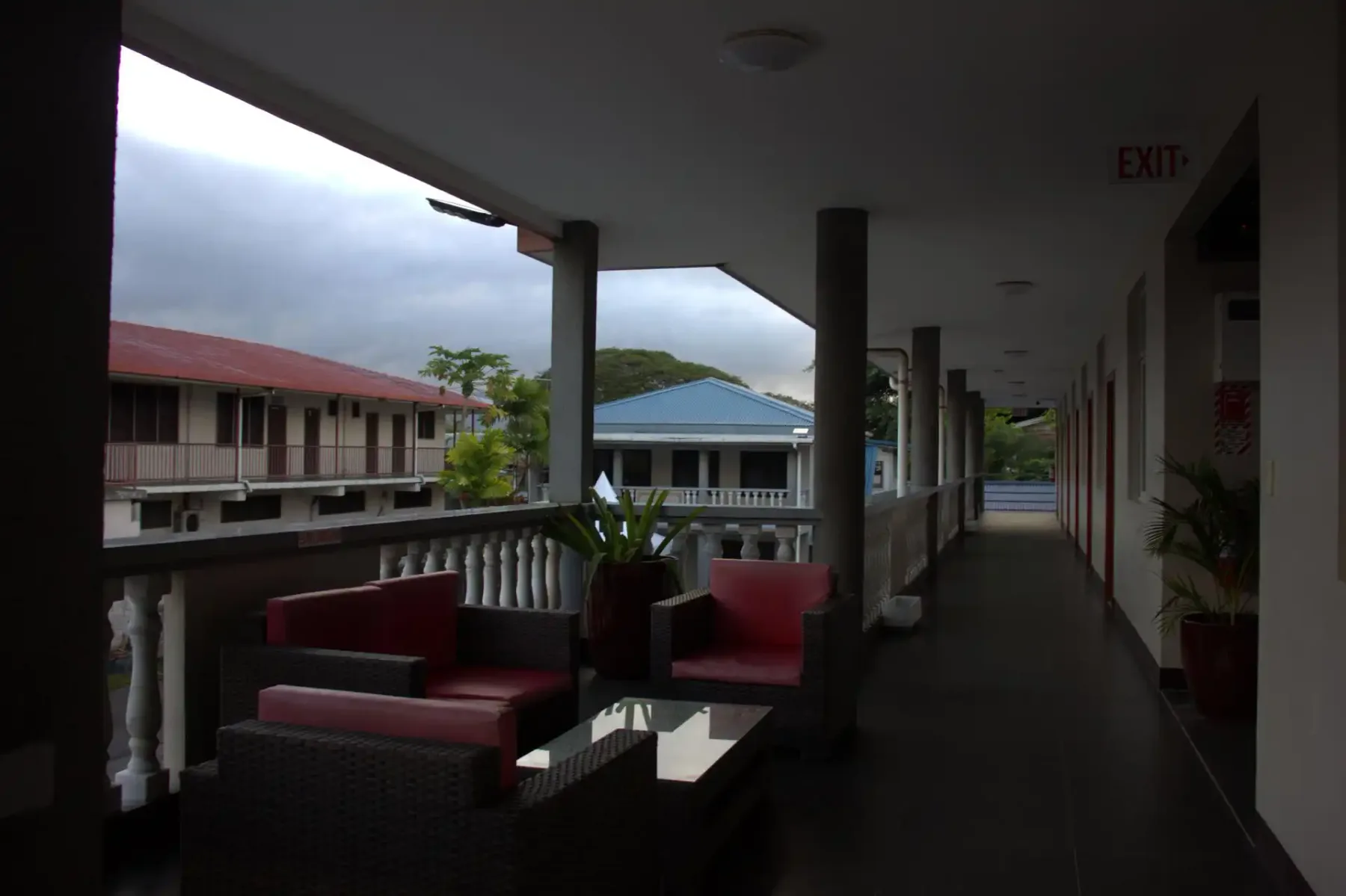 Hallway with seating and tables.