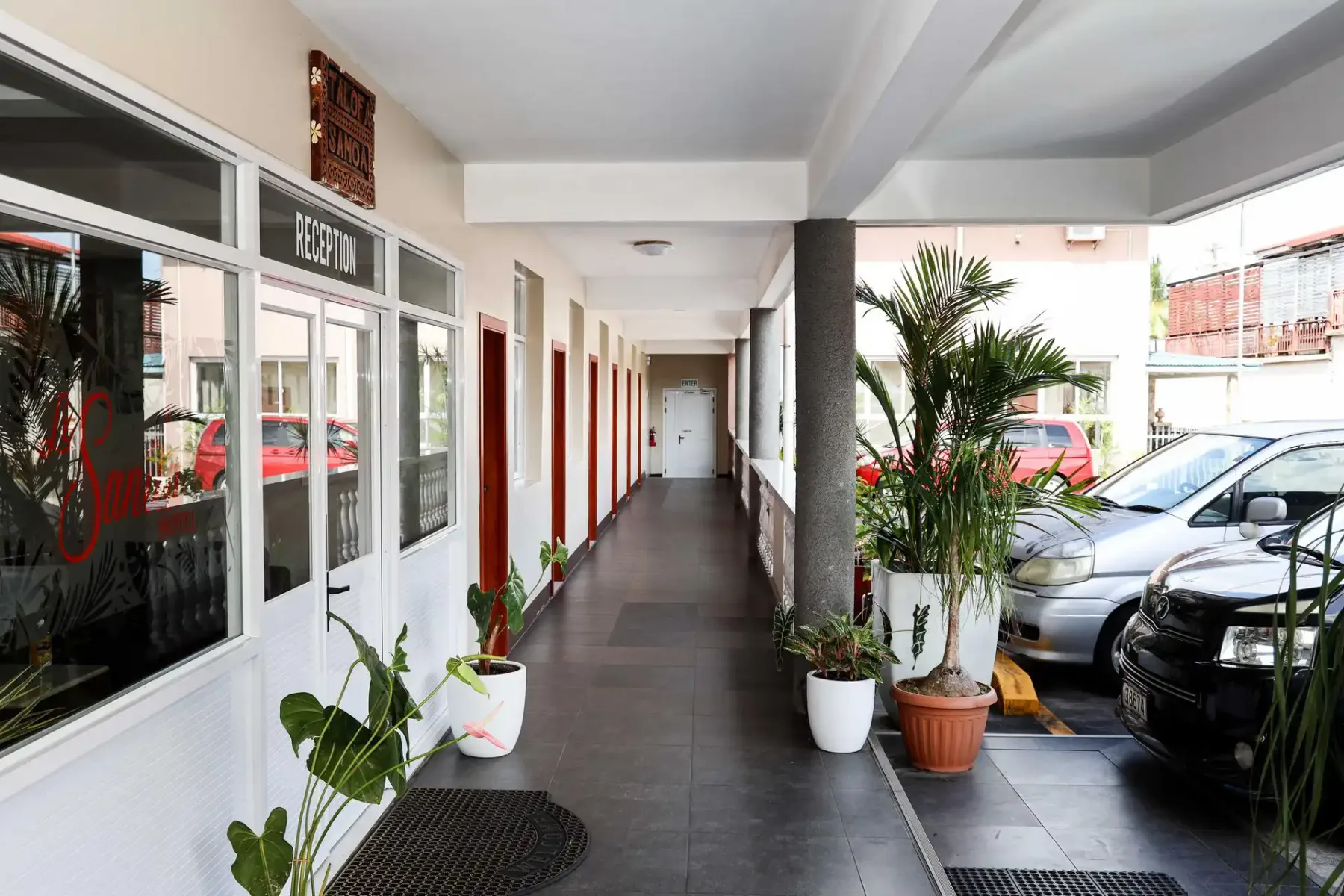 Hotel hallway, reception and parking area.