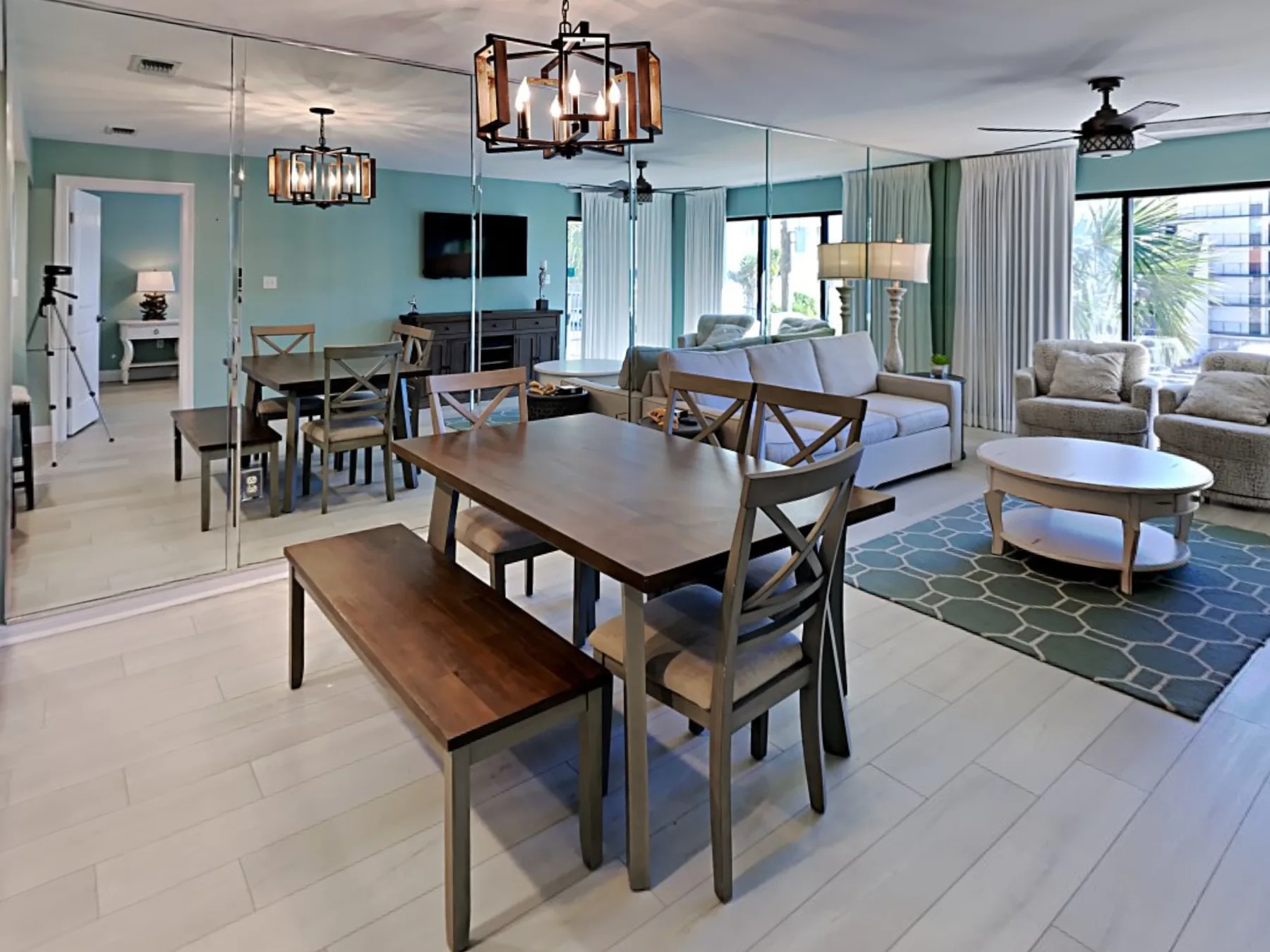An open-plan living and dining area with a wooden table and seating.