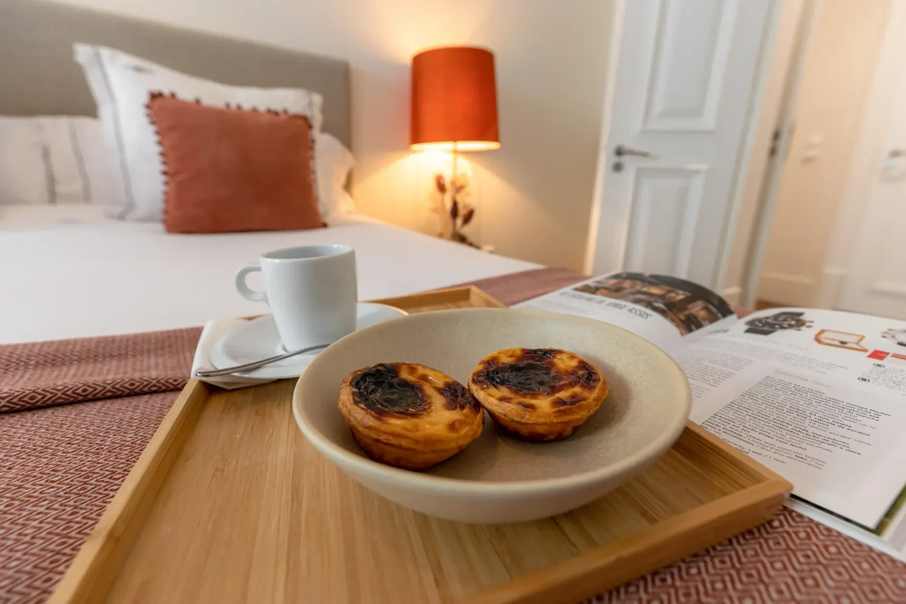Breakfast pastries and coffee served on a tray.