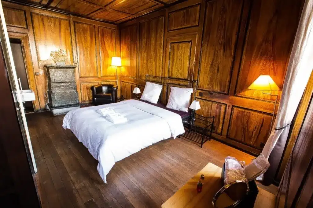 Deluxe room with a period soapstone stove