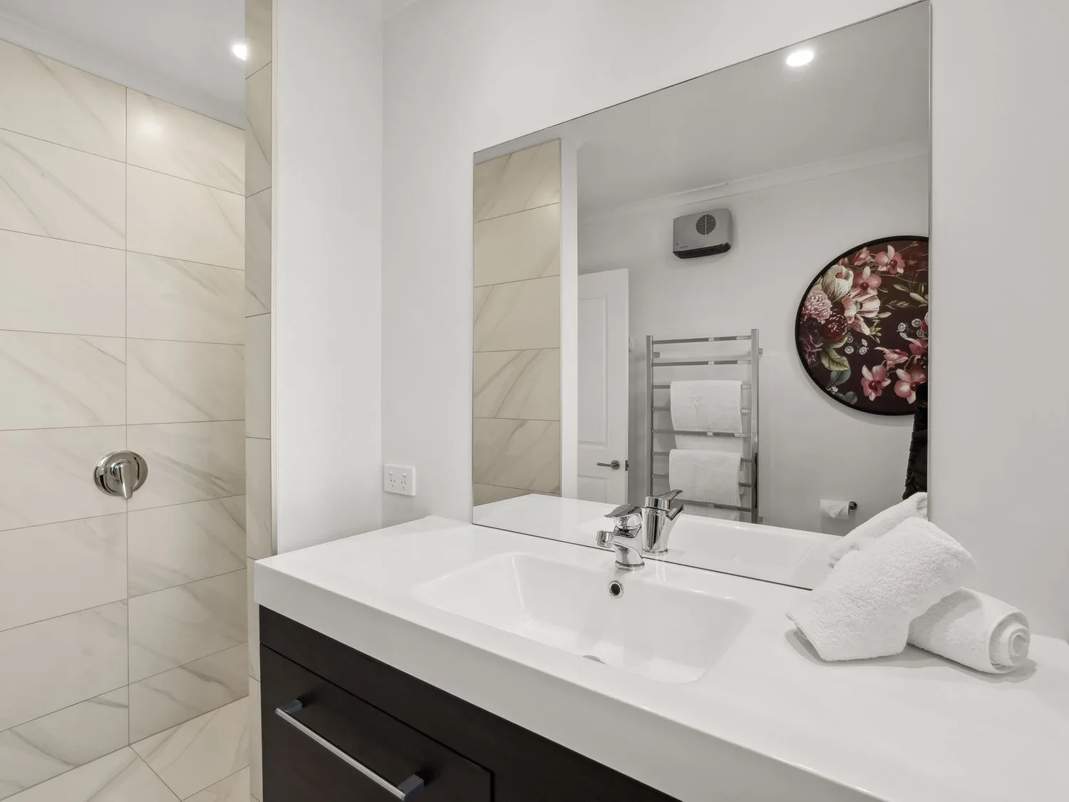 A bathroom with a sink and shower at Mako Haven - Mountain Outlook Wanaka