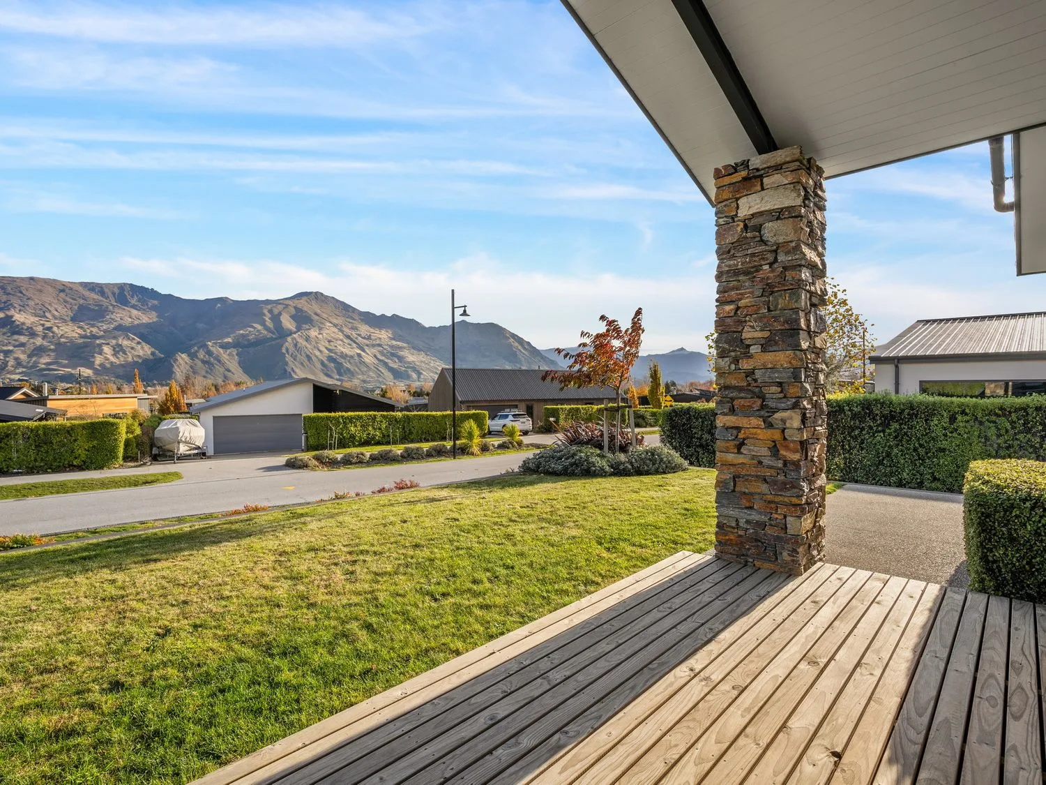 A view of mountains and grass from a deck at Mako Haven - Mountain Outlook in Wanaka