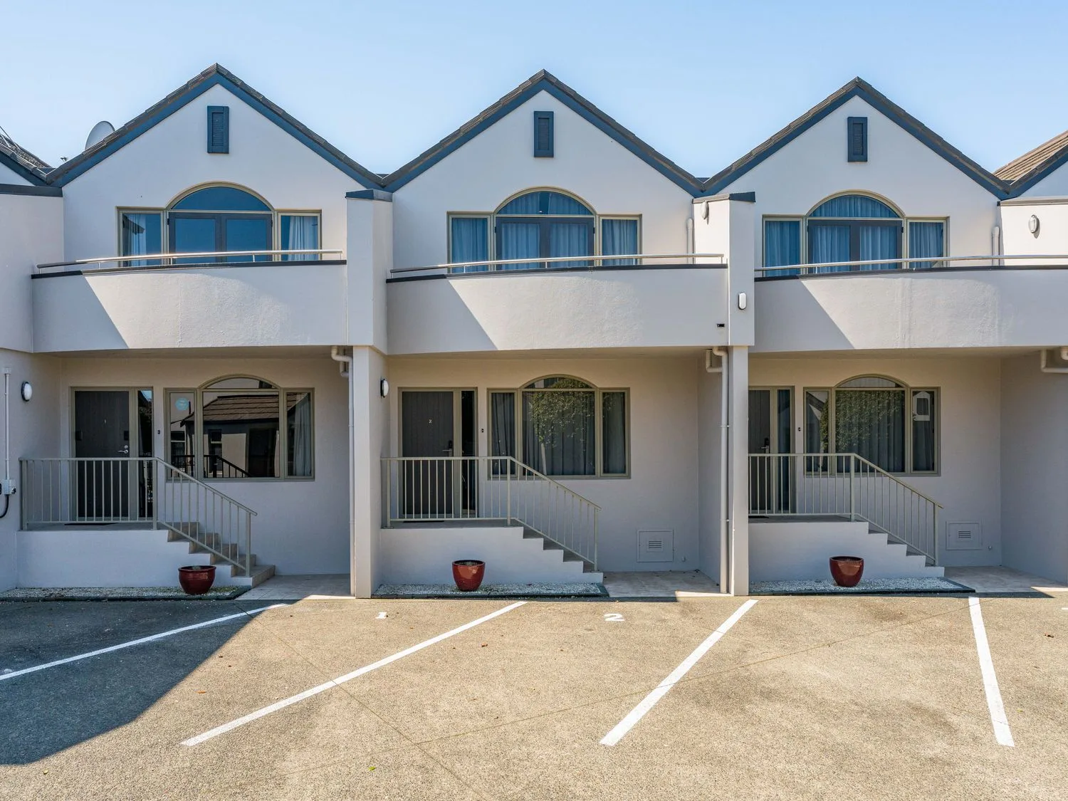 The exterior view of three connected two story units