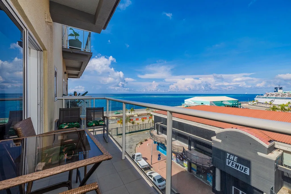 This balcony offers breathtaking sea views stretching across the turquoise horizon, with cozy seating perfect for your morning coffee or evening relaxation.