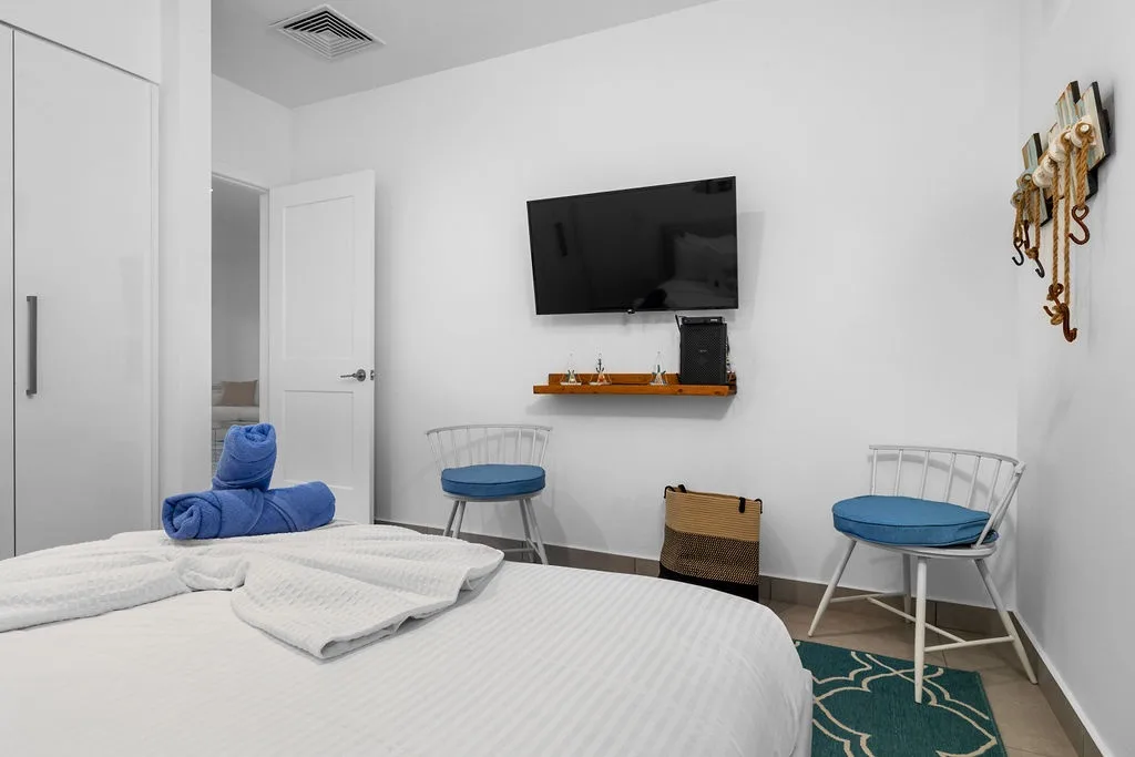 Unwind in your cozy bedroom with crisp linens, modern décor, and nautical touches that bring coastal charm to every corner of your stay.