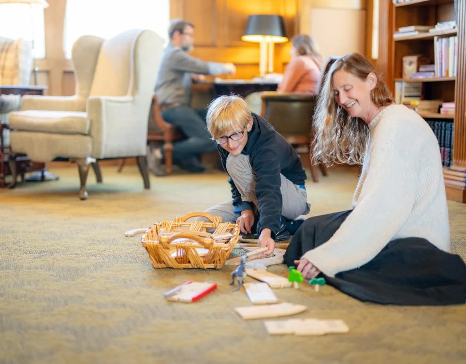 Guests playing a board game in the library