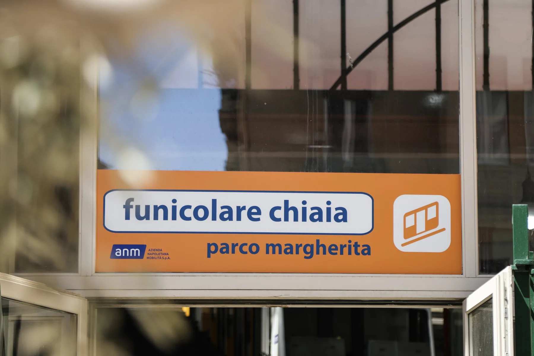 A transit station sign reads “funicolare chiaia” and “parco margherita.”