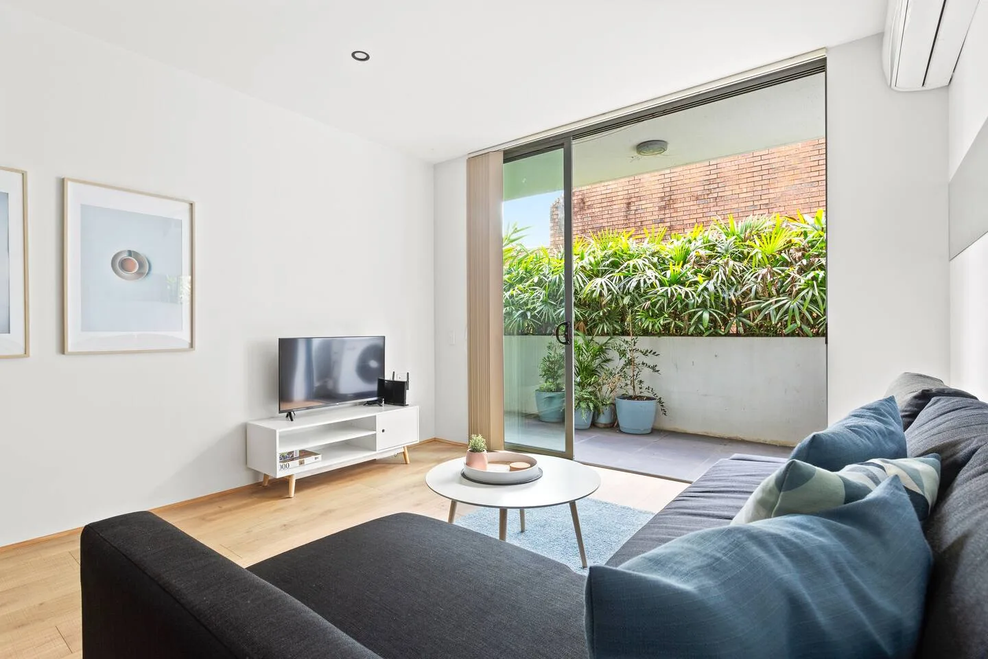 Get cosy in the living room with plush sofa seating and a TV to help relax after a busy day.