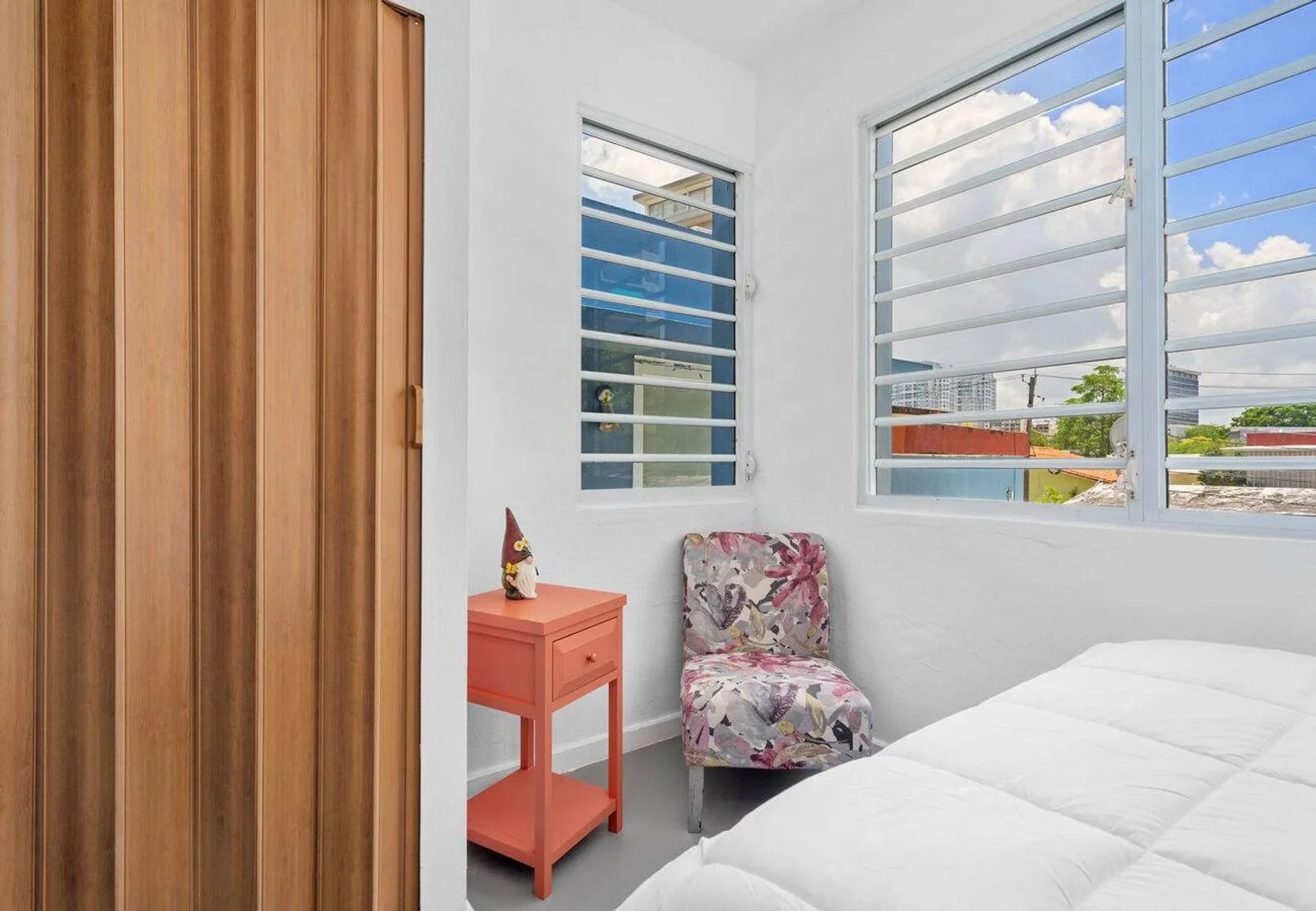 Queen bedroom 1 with wood closet and city light