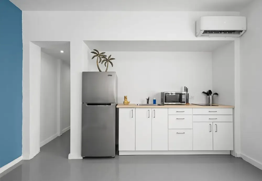 Kitchenette with full-size refrigerator and microwave