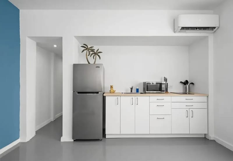 Kitchenette with full-size refrigerator and microwave
