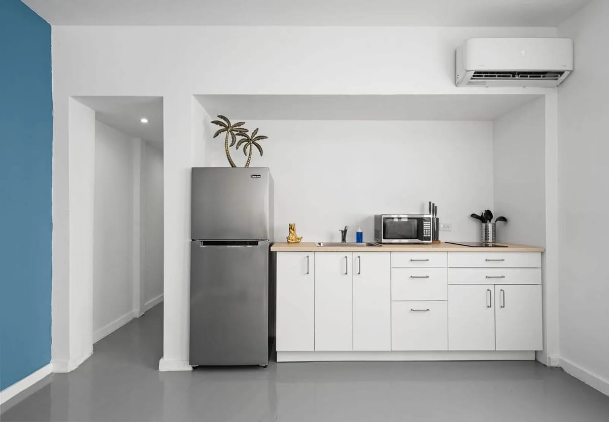 Kitchenette with full-size refrigerator and microwave