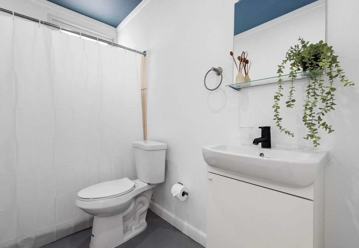 Clean full bathroom with walk-in shower