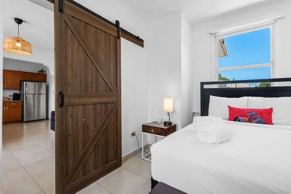 Spacious Master Bedroom with Tropical Decor.