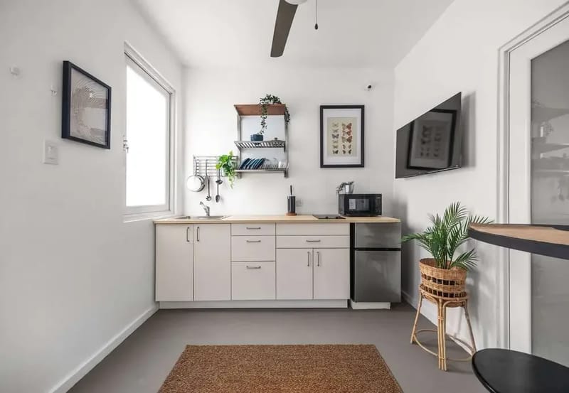 Kitchenette with induction cooktop, fridge & microwave