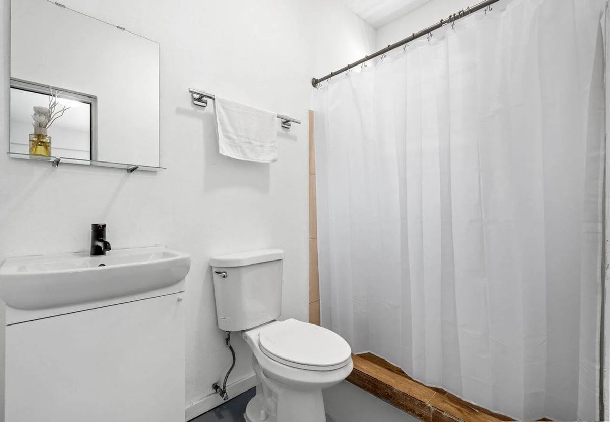 Full bathroom with shower and fresh toiletries