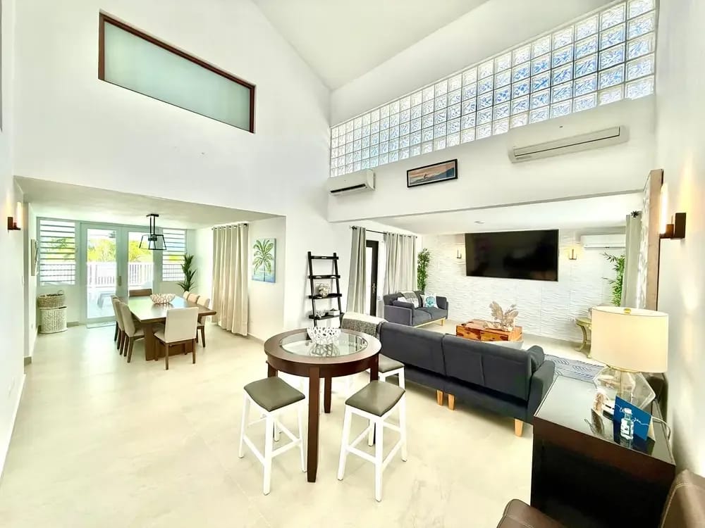 Bright double-height living room with A/C