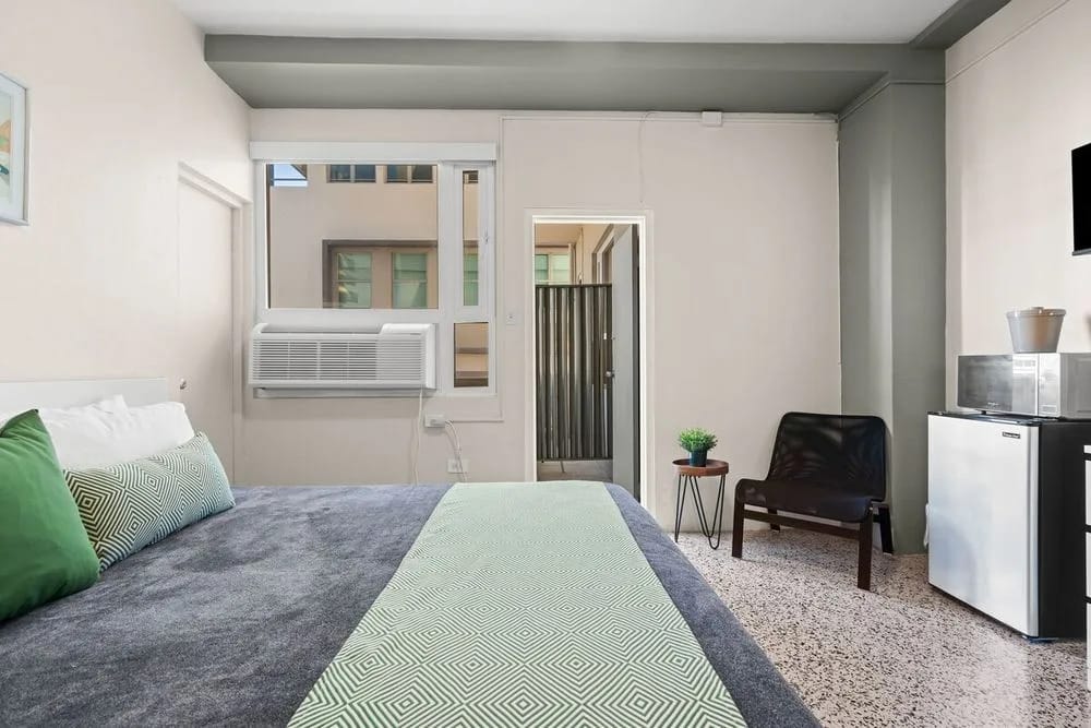 Inviting bed with soft pillows and crisp linens.