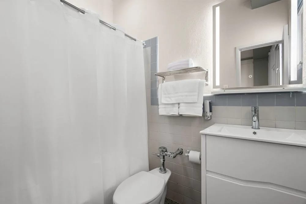 Bathroom equipped with towels and essentials.