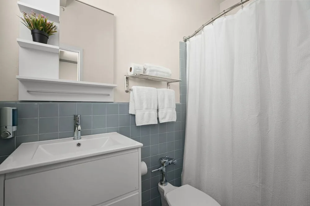 Sparkling clean and fully stocked! Our private bathroom provides fresh towels, essential toiletries, and a bright, pristine environment for your convenience.