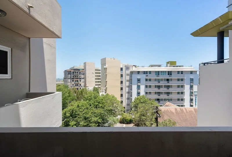 Private balcony view with an urban vista of San Juan.