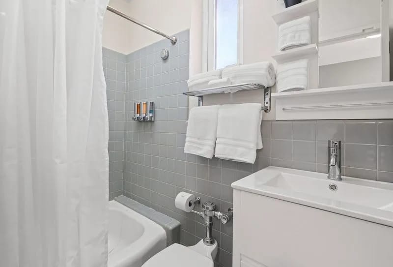 Bathroom with towels and shower area