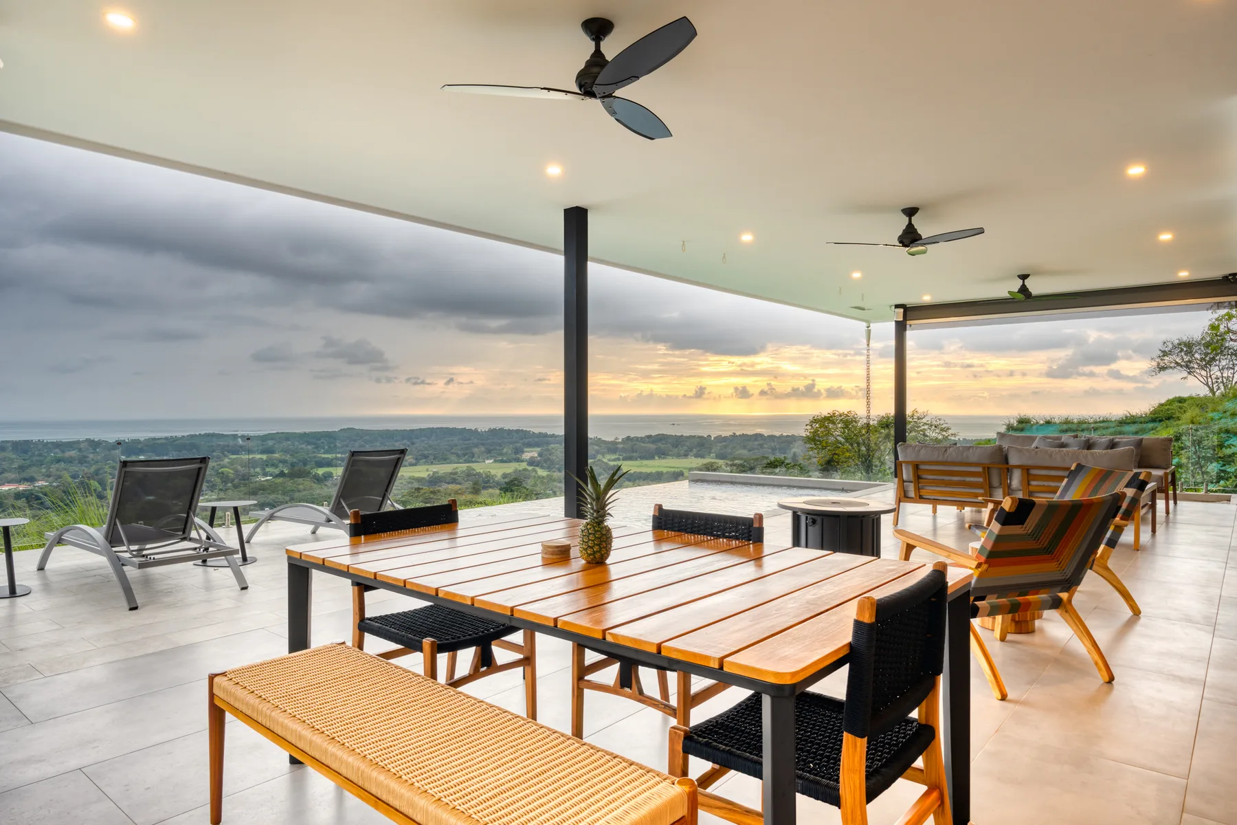 Covered terrace dining at sunset